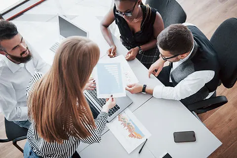 young-employees-sitting-office-table-usi